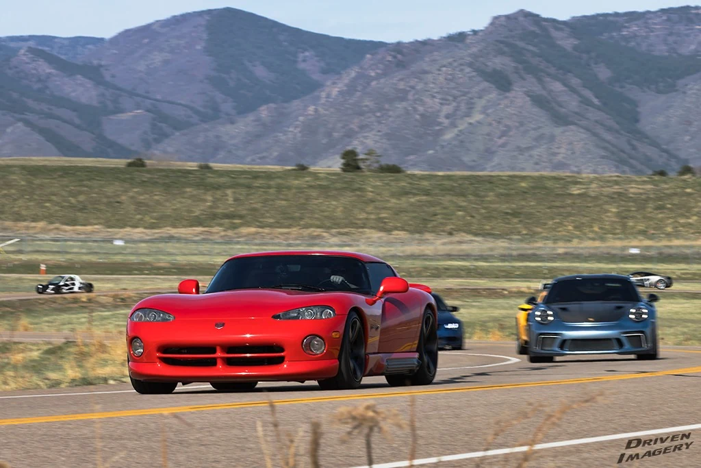 A red Viper and other performance cars on a circuit; Driven Imagery watermark retained